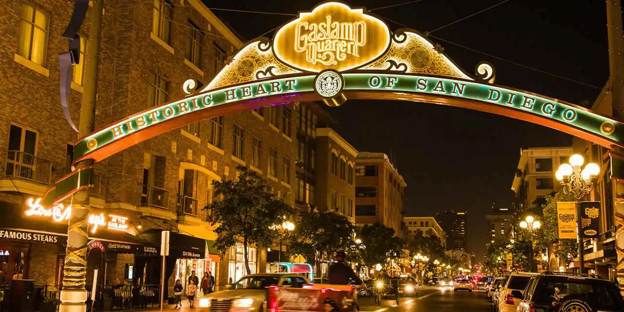 Nightlife scenes from the Gaslamp Quarter with historic buildings lit up.
